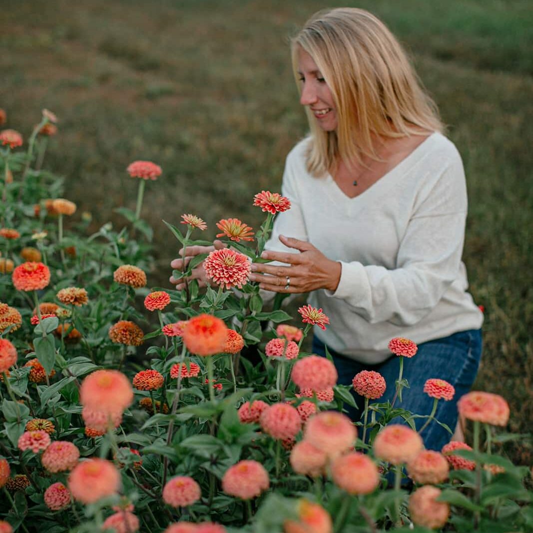 Katherine Brozek picking flowers at her farm